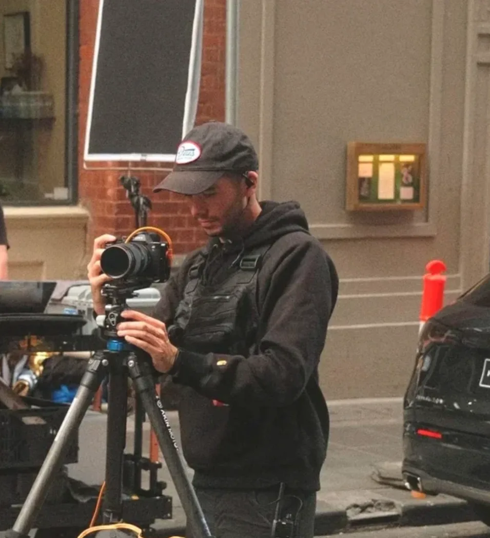 Brad working with a camera on a tripod